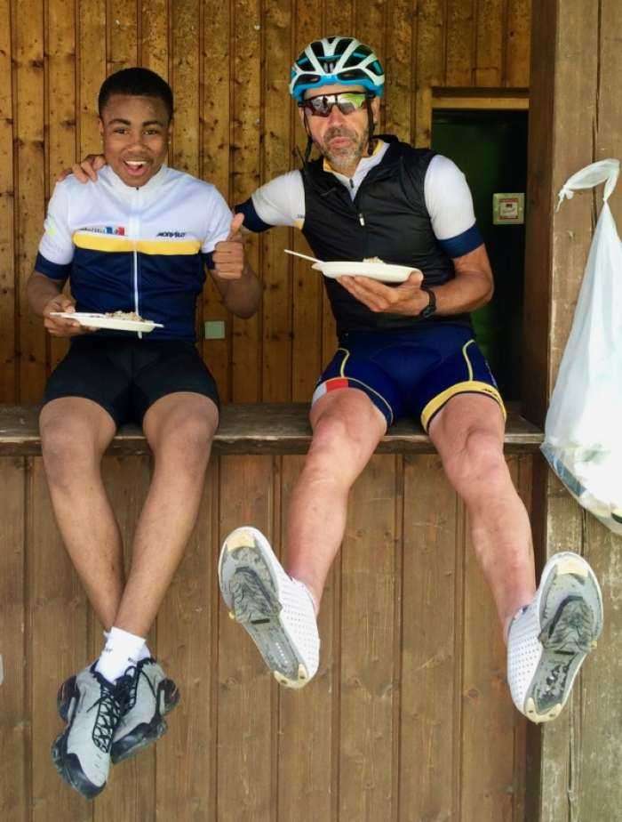 Student Tyrese with Phil, one of the riders, on last year's Tour de Force (photo courtesy TDF)